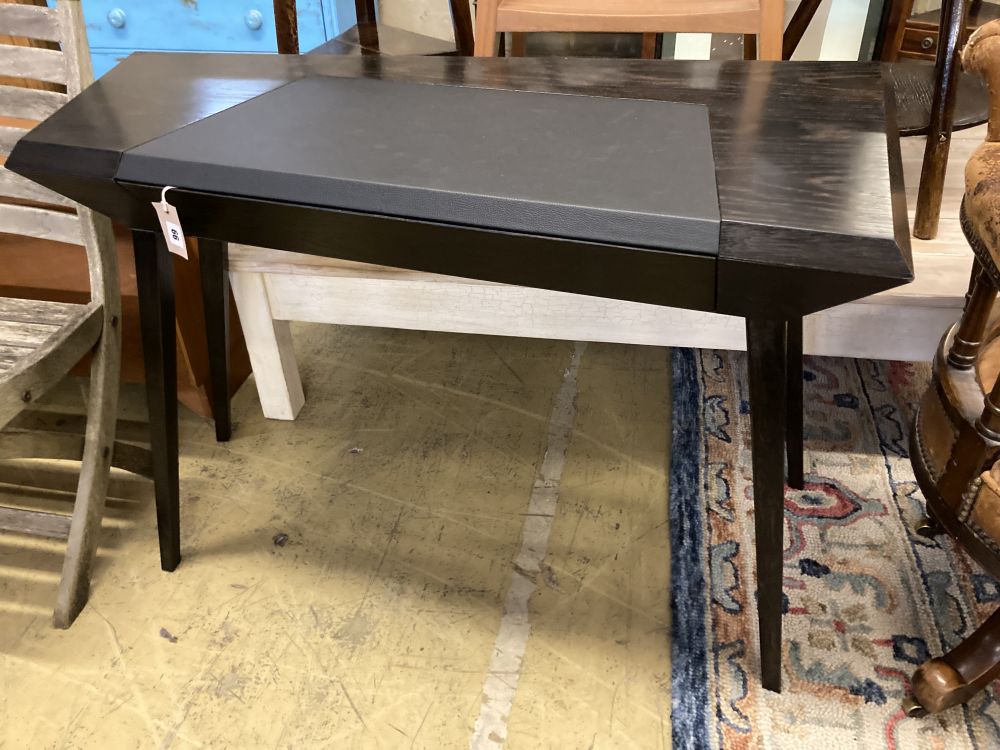 A Christopher Coane design onyx black oak desk, with copper lined push opening drawer, width 118cm, depth 60cm, height 77cm